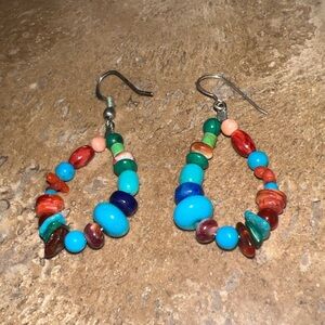 100% sterling silver earrings with authentic turquoise and coral stones.